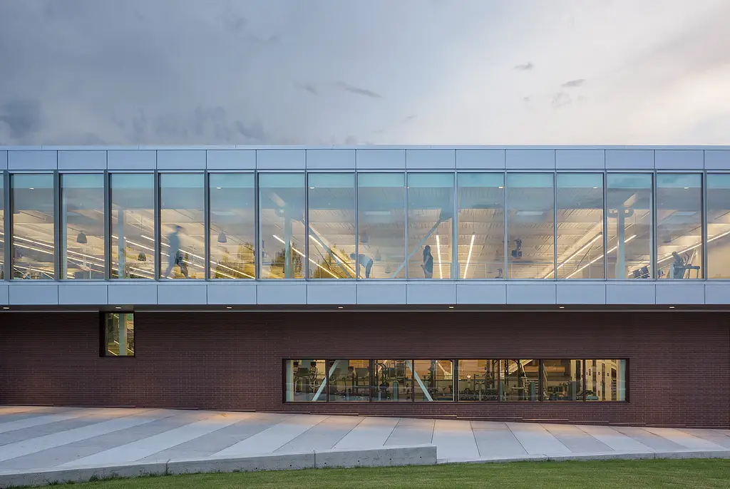 WhatcomCCStudentRecCtr S111704 03 N61 Bldg Side Profile Students Dusk